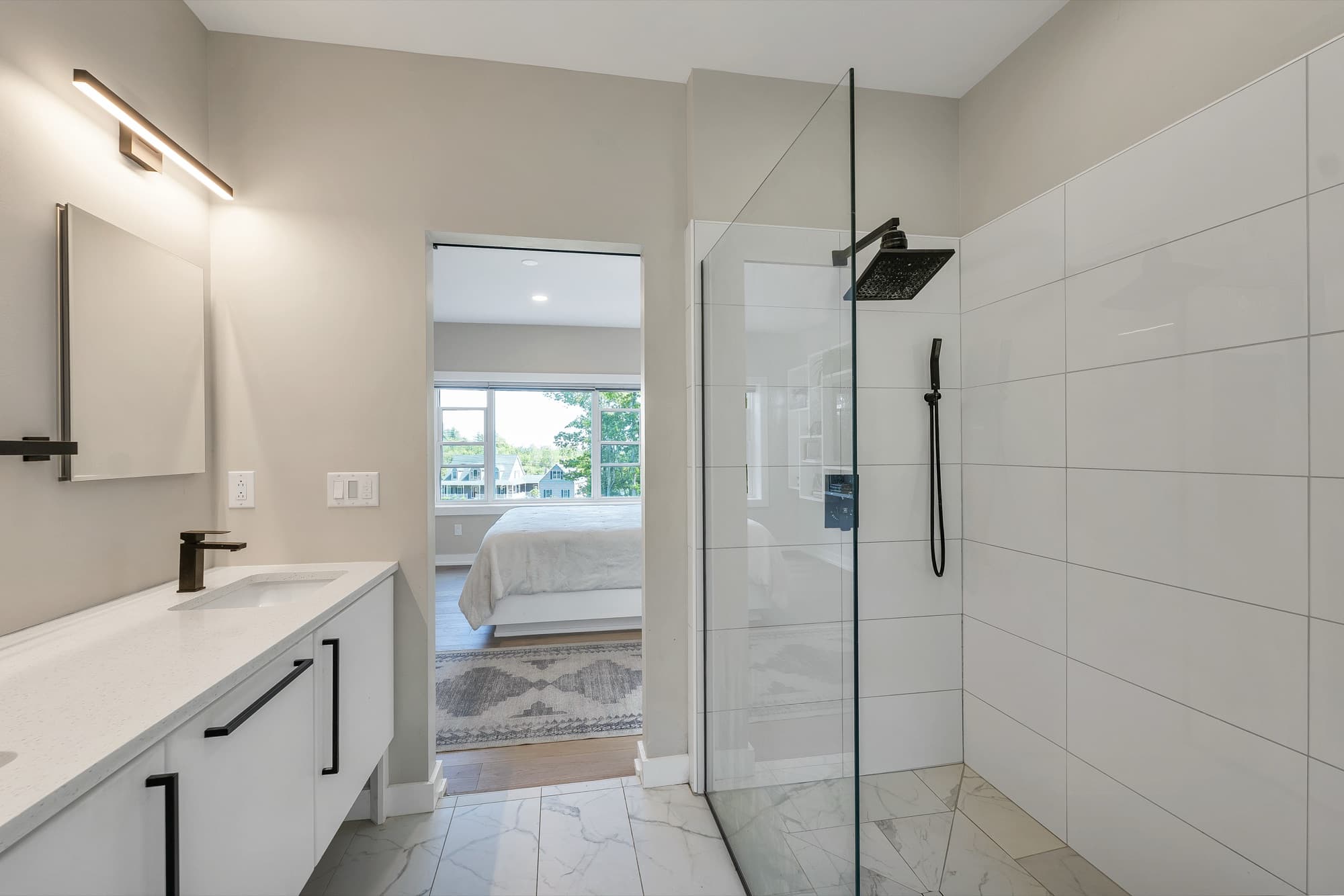 Walk-in tiled shower in the primary bath