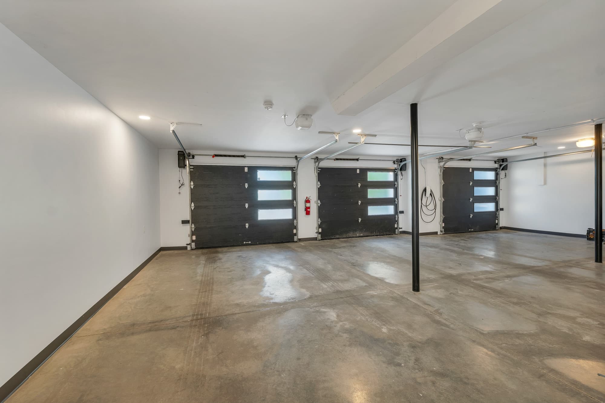 Spacious finished three-bay garage interior